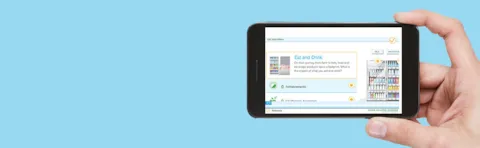 Hand holding smartphone with DNV GL's SustainableI app